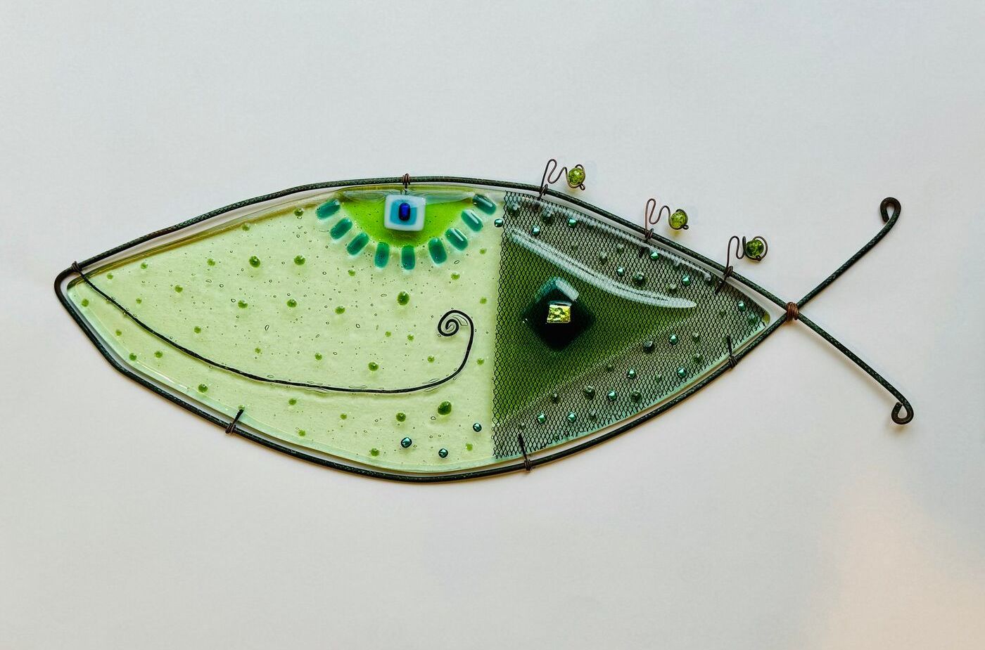Fused glass fish wall piece, green with dichroic eye