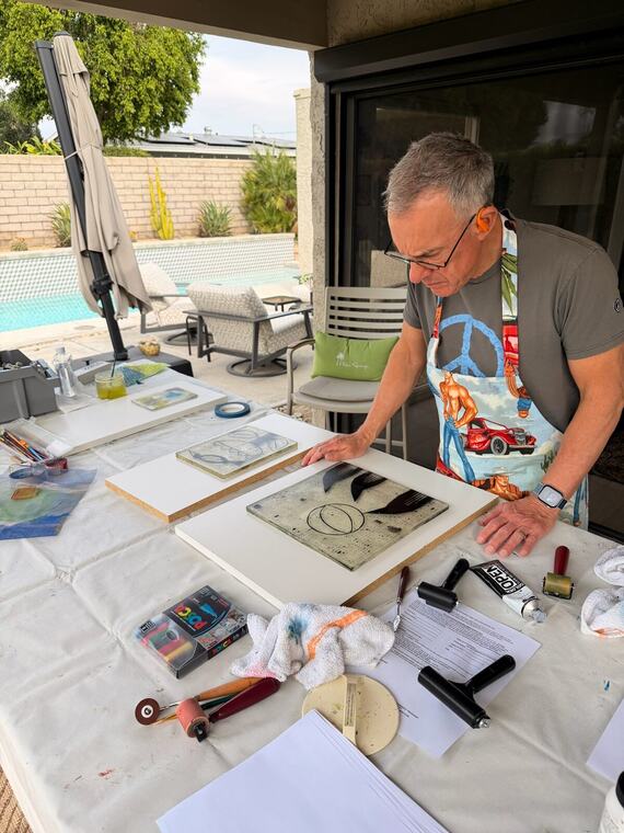 Jerry Harty printing outdoors on a patio table in Rancho Mirage, California