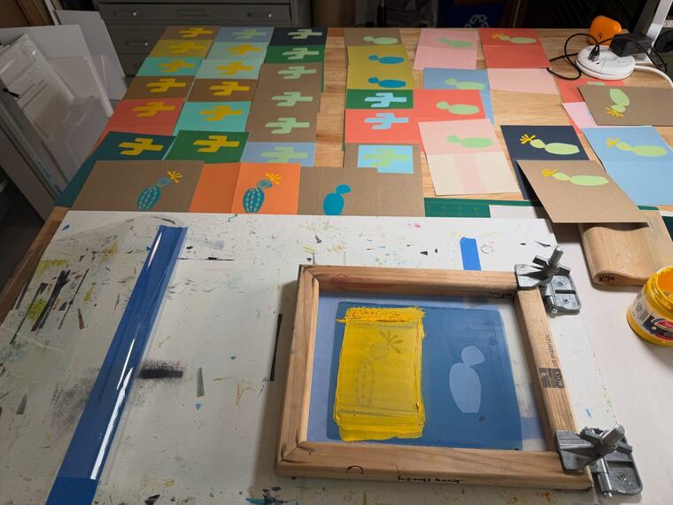 Screen-printed cactus cards drying in Jerry Harty's studio